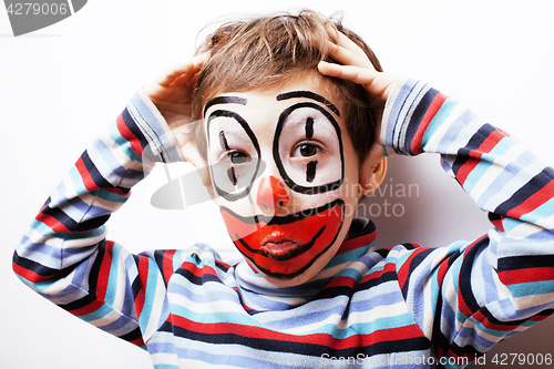 Image of little cute boy with facepaint like clown, pantomimic expression