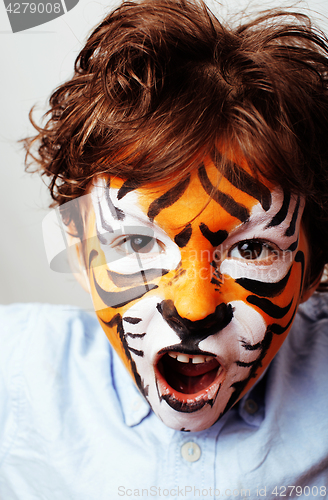 Image of little cute boy with faceart on birthday party close up, little 