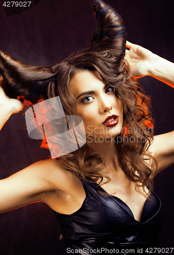 Image of bright mysterious woman with horn hair, halloween celebration