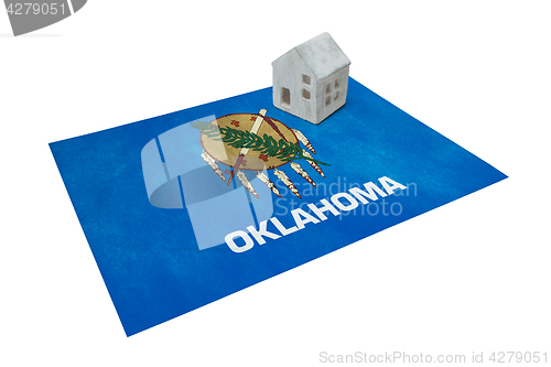 Image of Small house on a flag - Oklahoma