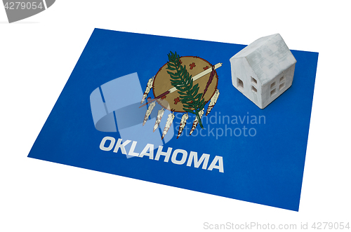 Image of Small house on a flag - Oklahoma