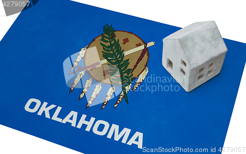 Image of Small house on a flag - Oklahoma