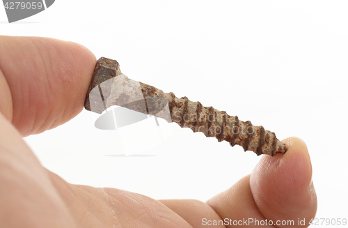 Image of Rusted old screw isolated