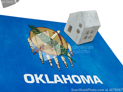 Image of Small house on a flag - Oklahoma