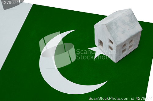 Image of Small house on a flag - Pakistan