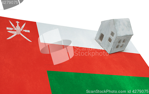 Image of Small house on a flag - Oman