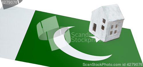 Image of Small house on a flag - Pakistan