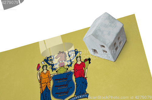 Image of Small house on a flag - New Jersey