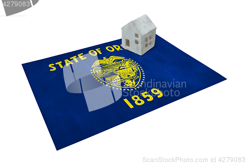 Image of Small house on a flag - Oregon