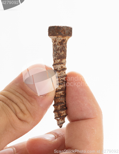 Image of Rusted old screw isolated