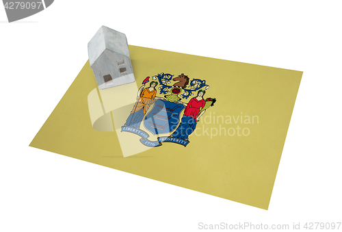 Image of Small house on a flag - New Jersey