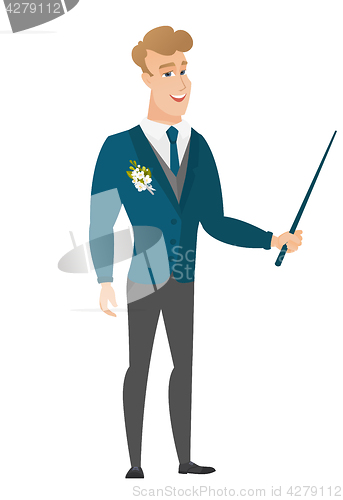 Image of Caucasian groom holding pointer stick.
