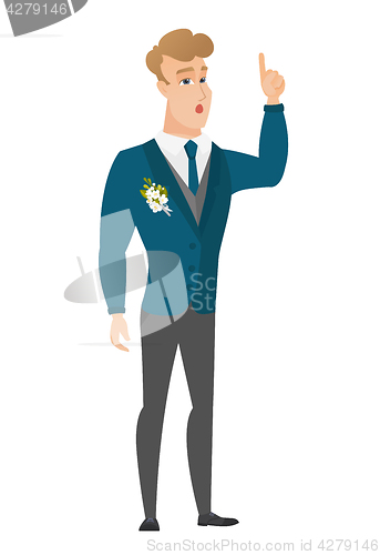 Image of Groom with open mouth pointing finger up.