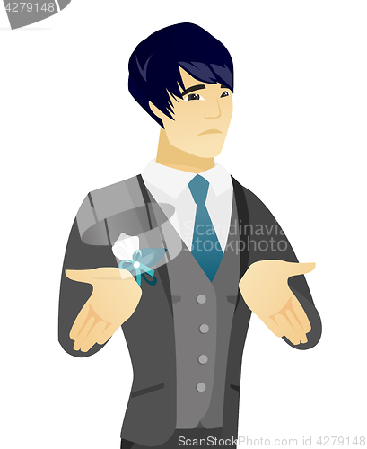 Image of Young asian confused groom shrugging shoulders.