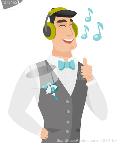 Image of Caucasiangroom listening to music in headphones.