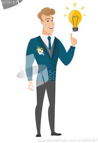 Image of Groom pointing at business idea light bulb.