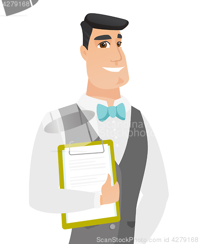 Image of Caucasian groom holding clipboard with documents.