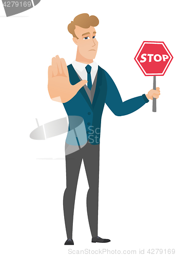 Image of Caucasian groom holding stop road sign.