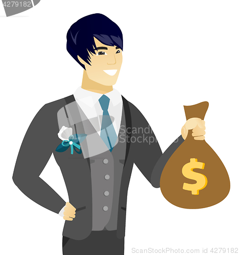 Image of Young asian groom showing a money bag.