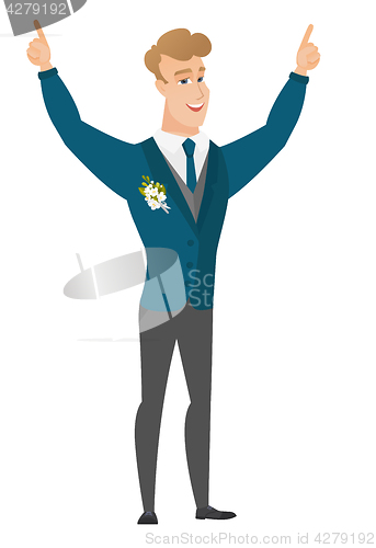 Image of Groom standing with raised arms up.