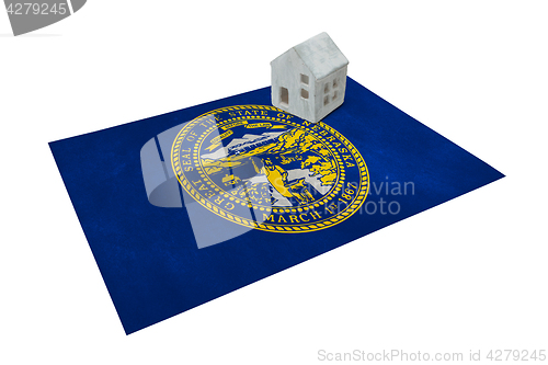 Image of Small house on a flag - Nebraska