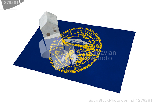 Image of Small house on a flag - Nebraska