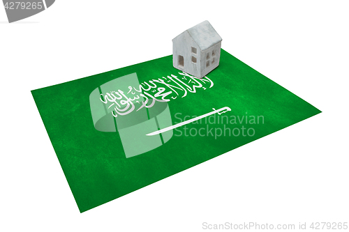 Image of Small house on a flag - Saudi Arabia