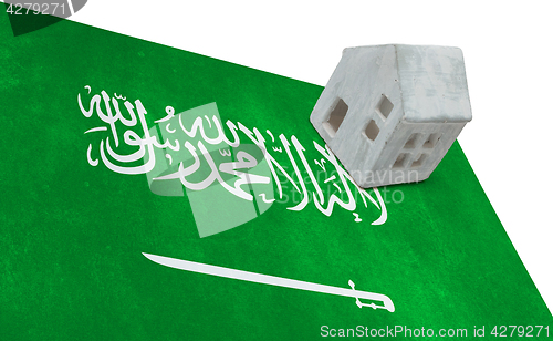 Image of Small house on a flag - Saudi Arabia