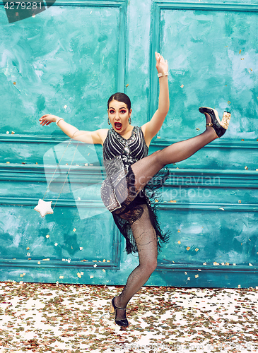 Image of The studio shot of woman as retro dancer