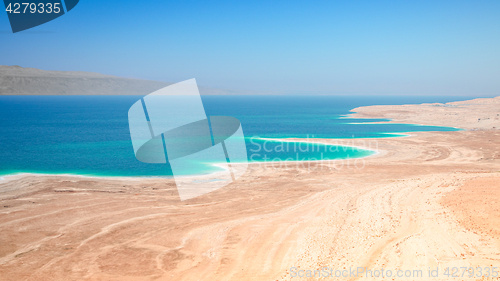 Image of Dead Sea salt lake surface shore and beach