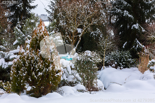 Image of beautiful winter garden covered by snow