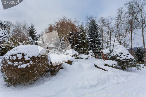 Image of beautiful winter garden covered by snow