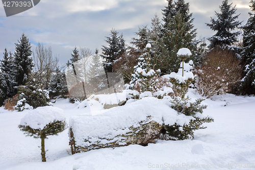 Image of beautiful winter garden covered by snow