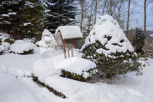 Image of beautiful winter garden covered by snow