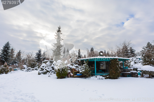 Image of beautiful winter garden covered by snow