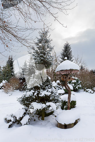 Image of simple bird feeder, birdhouse in winter