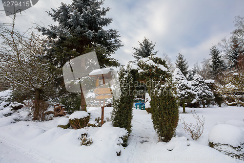 Image of beautiful winter garden covered by snow