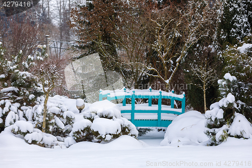 Image of beautiful winter garden covered by snow