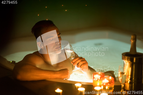 Image of man relaxing in the jacuzzi