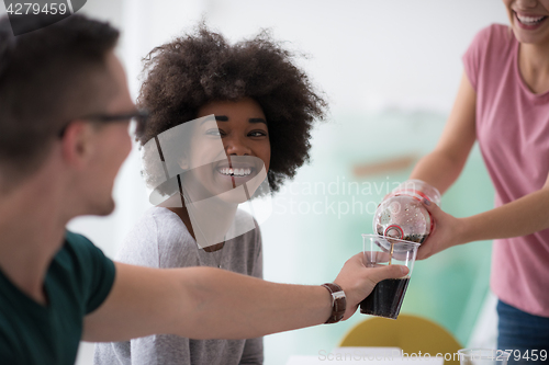 Image of multiethnic group of young people have a lunch break