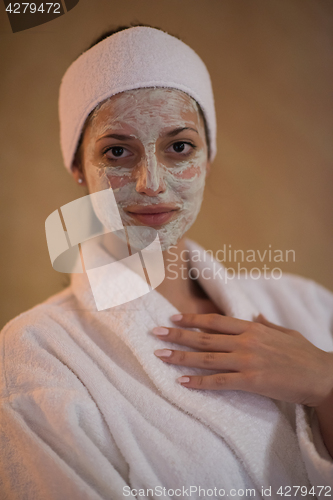 Image of Spa Woman applying Facial Mask