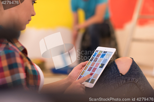 Image of couple doing home renovations