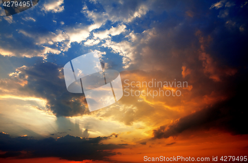 Image of Multicolor sunset sky with clouds and sun rays