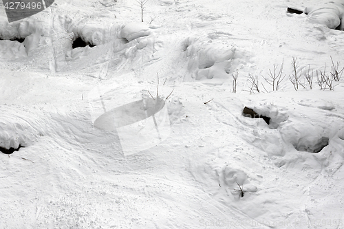 Image of Off-piste slope with tracks from ski and snowboard