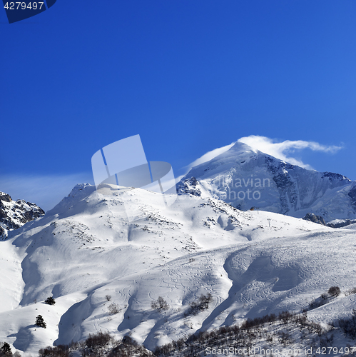 Image of Mount Tetnuldi and off-piste slope with track from ski and snowb