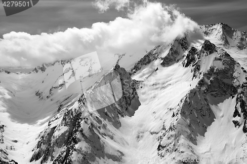Image of Black and white winter mountains in clouds