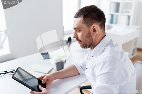 Image of businessman with tablet pc at office