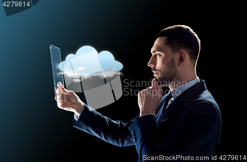 Image of businessman working with transparent tablet pc