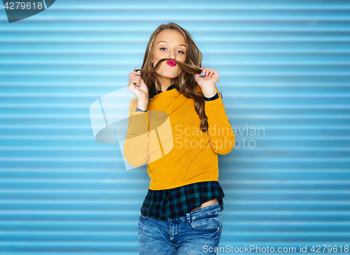 Image of happy young woman or teen girl in casual clothes