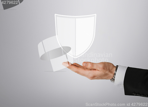 Image of close up of man with virtual antivirus shield icon